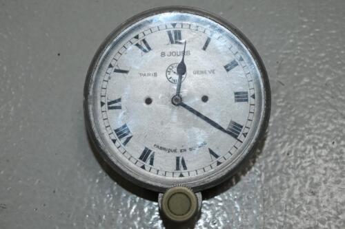 JAEGER: A 8-day Jaeger dash clock, glass 7.5cm diameter