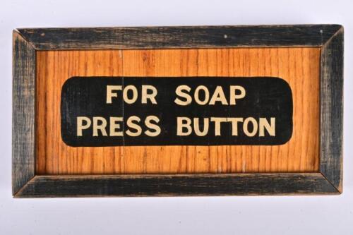 VICTORIAN RAILWAYS: A framed wooden panel 'For Soap Press Button' from a wooden bodied carriage, 12 x 24cm