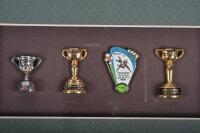 PINS: A collection of Australian sporting related pins, framed and glazed, 21 x 31cm overall - 2