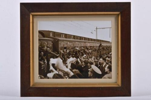 PORT MELBOURNE: A photograph of train with A.I.F. reinforcements at Port Melbourne station in 1940, framed and glazed, 31.5 x 36.5cm overall