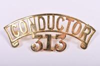 VICTORIAN RAILWAYS: A brass cap badge 'Conductor 303'
