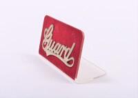 SOUTH AUSTRALIAN RAILWAYS: A brass 'Guard' cap badge, on stand, 8cm long - 2