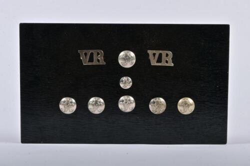 VICTORIAN RAILWAYS: A collection of seven VR metal buttons and two metal VR labels for jackets, mounted an old box lid, 16 x 28cm overall