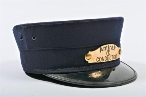 USA: An original cap featuring metal badge for 'Amtrak Conductor', the cap by Leopold Morse