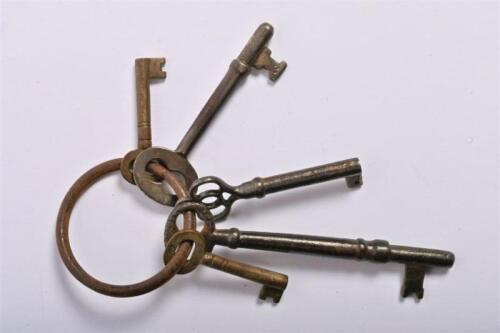 KEYS: A collection of four antique metal warded keys for furniture