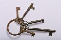 KEYS: A collection of four antique metal warded keys for furniture