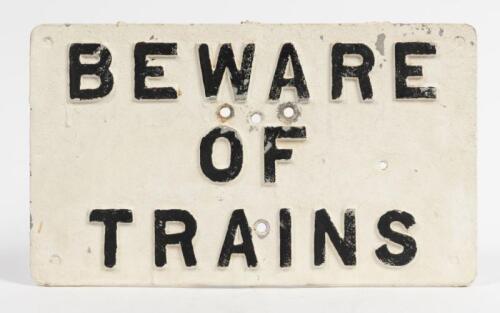 WARNING SIGN: A painted cast aluminium warning sign 'Beware of Trains', 23 x 39cm