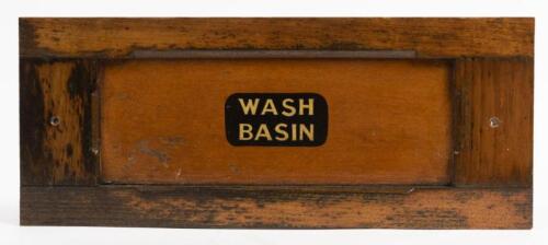 VICTORIAN RAILWAYS: A framed wood panel 'Wash Basin' from a wooden bodied carriage, 21 x 51.5cm
