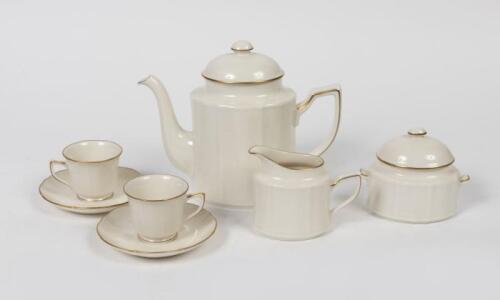 NORITAKE: A Noritake porcelain tea set for two, comprising a teapot, lidded sugar bowl, creamer and two caps and saucers, the tea pot 18cm high