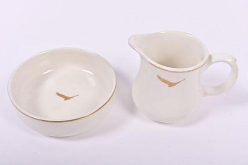 INDIAN PACIFIC: An Indian Pacific gilt rimmed ceramic creamer and sugar bowl, the creamer 8 cm high