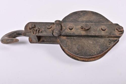 PULLEY: An antique industrial cast iron pulley, 37cm long