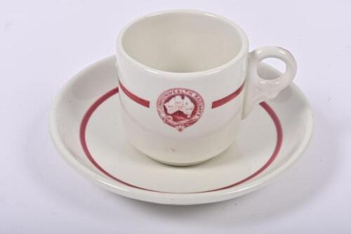 COMMONWEALTH RAILWAYS: A ceramic coffee can and saucer with Commonwealth Railways insignia, 6cm high overall