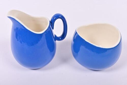 RHODESIA RAILWAYS: A distinctive blue ceramic cream jug and small bowl with Rhodesia Railways insignia, the jug 11cm high