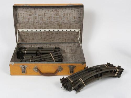 TRACK: A small case of O gauge track, including straight and curved pieces