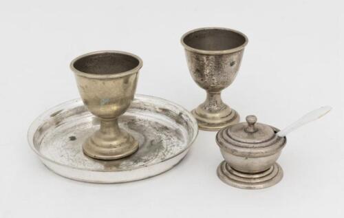 VICTORIAN RAILWAYS: A small silverplate egg set, comprising two egg cups, a salt with original spoon and dish with Victorian Railways stamp to base, the salt missing glass insert, the dish 11.5cm diameter