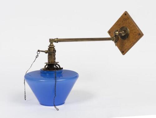 GAS LAMP: A brass swing arm gas lamp with blue glass shade, 32cm long extended