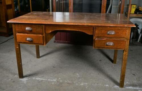 DESK: A 1940/50s oak desk with two drawers, 76cm high, 136cm wide,74cm deep