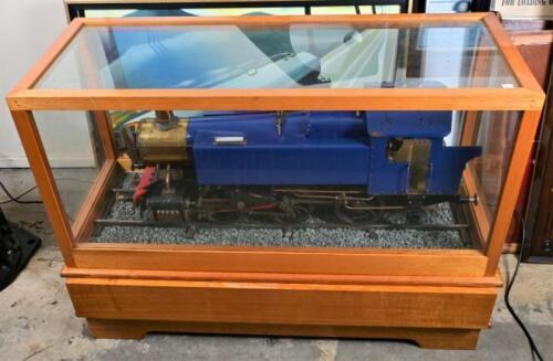 A large operational model of British inspired 0-6-0 tank locomotive 'Speedy', built by three brothers in Australian home workshop, attractive oak and glass display case on stand, original plans and instructions, does not come with current boiler certifica
