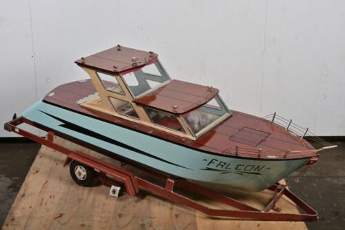 MODEL YACHT: A large scratch built battery powered model of a yacht, with trailer, functionality unknown, 150cm long including trailer