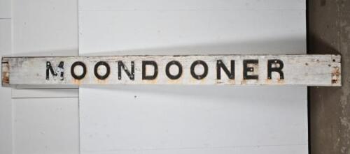 QUEENSLAND RAILWAYS: MOONDOONER station name board, cast iron letters on original timber backing board, also featuring painted black lettering on back of name board, 280 x 25cm