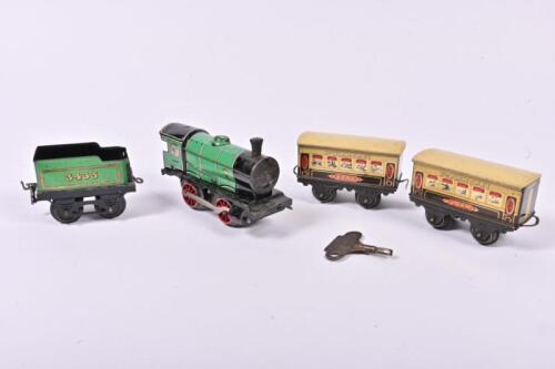 MECCANO: A five piece clockwork Hornby set including a 0-4-0 locomotive 3435, tender, Pullman carriage Zena and Pullman carriage Joan