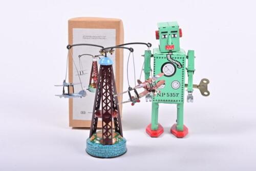 ROBOT LILIPUT: A reproduction 'Robot Liliput' tin toy and a wind-up aeroplane merry-go-round, the Robot, 16cm high