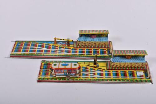 TIN RAILWAY: A 1960s Indian lithograph printed 'Local Shuttle' clockwork tin train and track by Lovely Toys, with original key, 69cm long