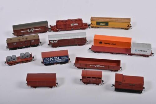 HO GAUGE: A collection of HO gauge model wagons, including V/Line and Victorian Railways