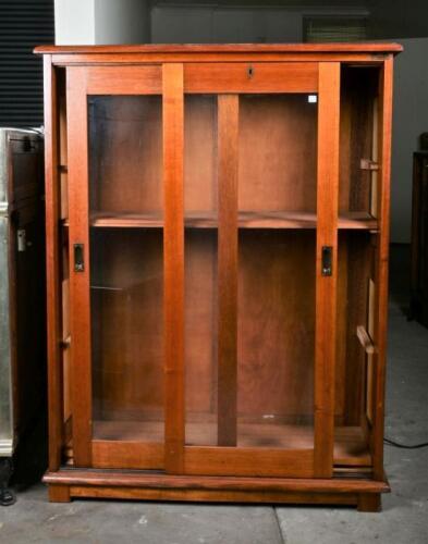 DISPLAY CASE: An oak display case, with two front sliding doors, 129cm high, 98cm wide, 42cm deep