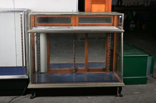 DISPLAY CASE: An oak and metal mirror back display case with separate counter top display by Boston Co Melbourne, 106cm high, 122cm wide, 56cm deep