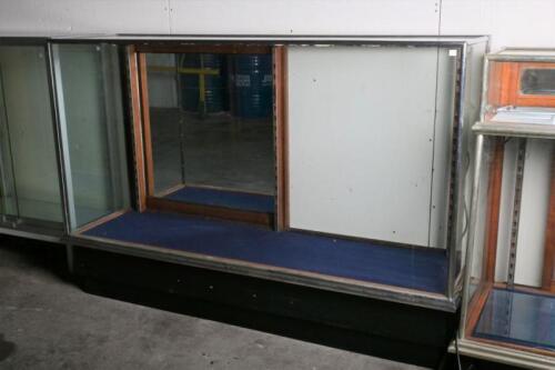 A large early 20th century chrome and glass mirror back counter display case, 110cm high, 166cm wide, 51cm deep