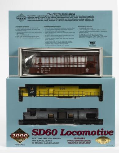 PROTO: Two NOS HO scale model rail locomotives including a SD60 locomotive 'Chicago and North Western #8001' (Limited Edition) & a Proto 2000