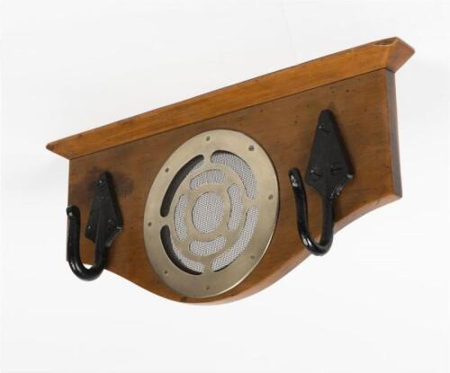VICTORIAN RAILWAYS: A wooden plaque with two cast iron clothes hooks ex. Newport Workshops and a central air vent from a steel bodied carriage, 23cm high, 50cm wide, 8cm deep