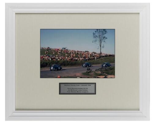 NEPTUNE: A photograph signed by Norm Beechey and Jim McKeown from Lakeside 1964, with plaque, mounted and framed, frame overall 46.5cm high x 56.5cm wide.