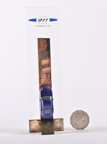 PORSCHE: An original Porsche issued desk display piece for the release of the 911 996, 1997.