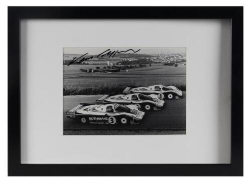 PORSCHE: An period photograph of the 1/2/3 works Rothmans 956s, signed by Vern Schuppan (car #2), framed