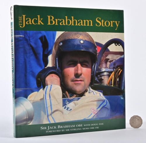 JACK BRABHAM: A large signed hardback book titled "The Jack Brabham Story" autobiography with Doug Nye, signed and personalised by Jack Brabham to the half title page