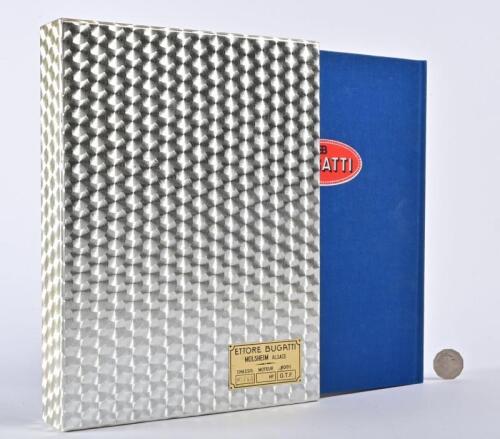 BUGATTI: A very large linen bound copy of "Bugatti: Magnum" in faux engine turned slipcase, with metal plate to slipcase designating #1763, stamped to plate