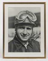 FANGIO: A large signed black and white photograph "To John, Manuel Fangio, 24/10/86"
