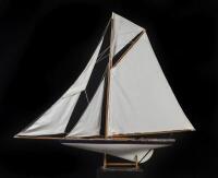 POND YACHT: A large display pond yacht on stand, some losses to bow