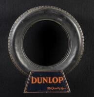 DUNLOP: A circa 1920s/1930s tin Dunlop tyre stand with tyre.
