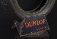 DUNLOP: A circa 1920s/1930s tin Dunlop tyre stand with tyre. - 2
