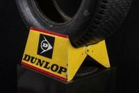 DUNLOP: A circa 1980s plastic Dunlop tyre stand with tyre, 34cm wide x 17cm high. - 2
