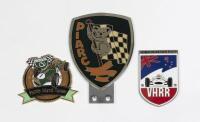 VICTORIAN RACING: Three Victorian enamelled car grille badges, the largest 11.8cm high, 8.4cm wide