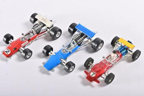 FORMULA 1: Three various 1:32 scale circa 1960s Formula 1 car models, being Ferrari and Matra by Polistil/Politoys and one Lotus by Dinky Toys
