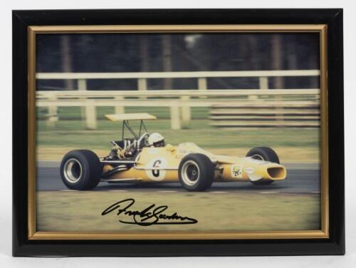 FRANK GARDNER: A signed photograph of Frank Gardner in the "Yellow Submarine" of Alec Mildren Race Team, signed by Frank Gardner in black ink,framed and glazed, image 20cm high x 28.5cm wide