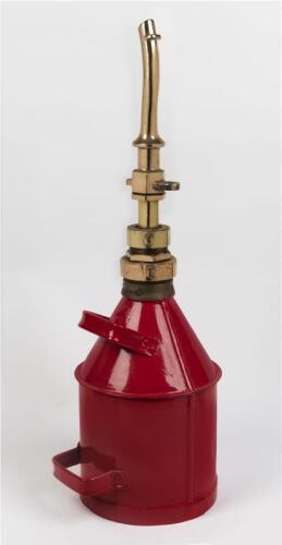 OIL DISPENSER: A restored early heavy gauge iron and brass two gallon oil dispenser, 75cm high