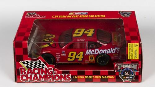NASCAR: A 1:24 scale Racing Champions Ford NASCAR model, signed by nascar driver Bill Elliot