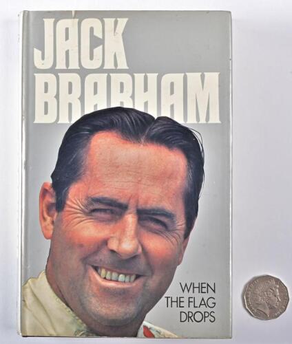 JACK BRABHAM: A signed copy of "When The Flag Drops" hardcover autobiography, signed in blue ink to the title page by Jack Brabham