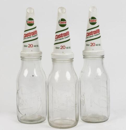 CASTROL: Three Castrol Castrolite 1 quart 20 grade glass oil bottles with plastic tops, each 37cm high